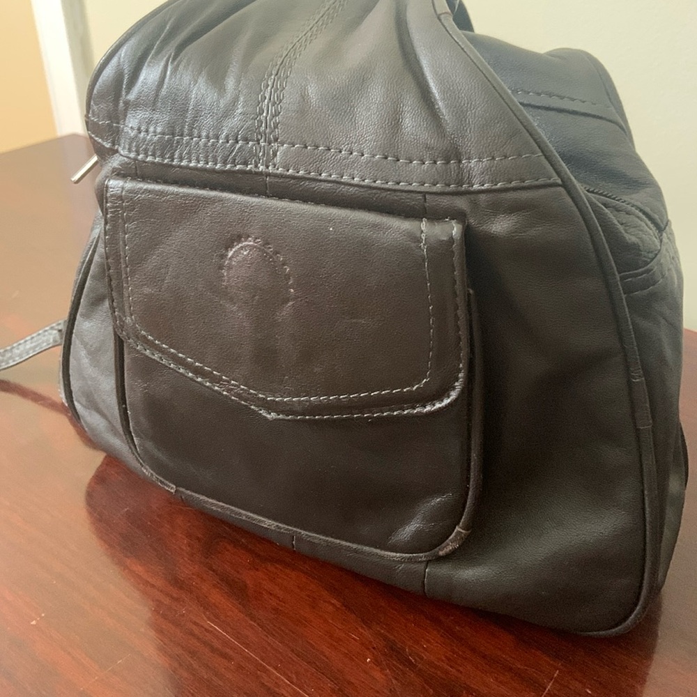 Leather backpack purse. Dark chocolate brown. Zip closure to secure items